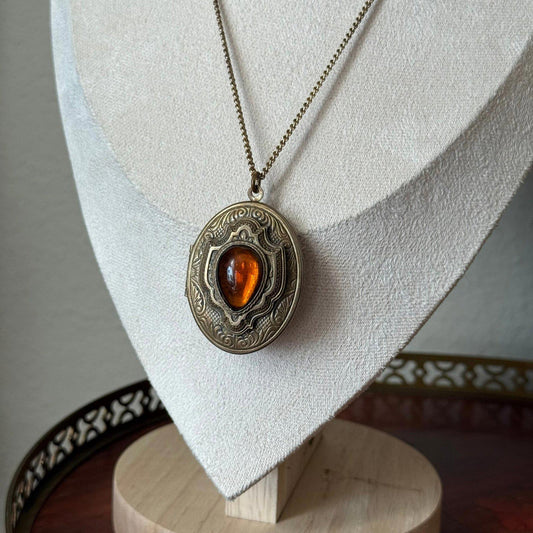 Vintage gold tone locket with glass faux amber Stone necklace