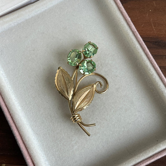 Weiiss gold tone floral brooch green glowy rhinestones