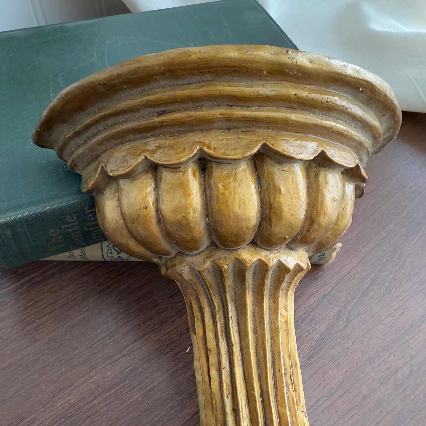 Gold tone wall shelf