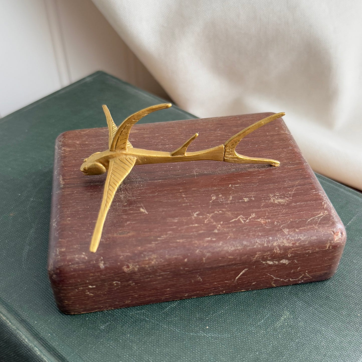 MCM Gold figurine on wood block