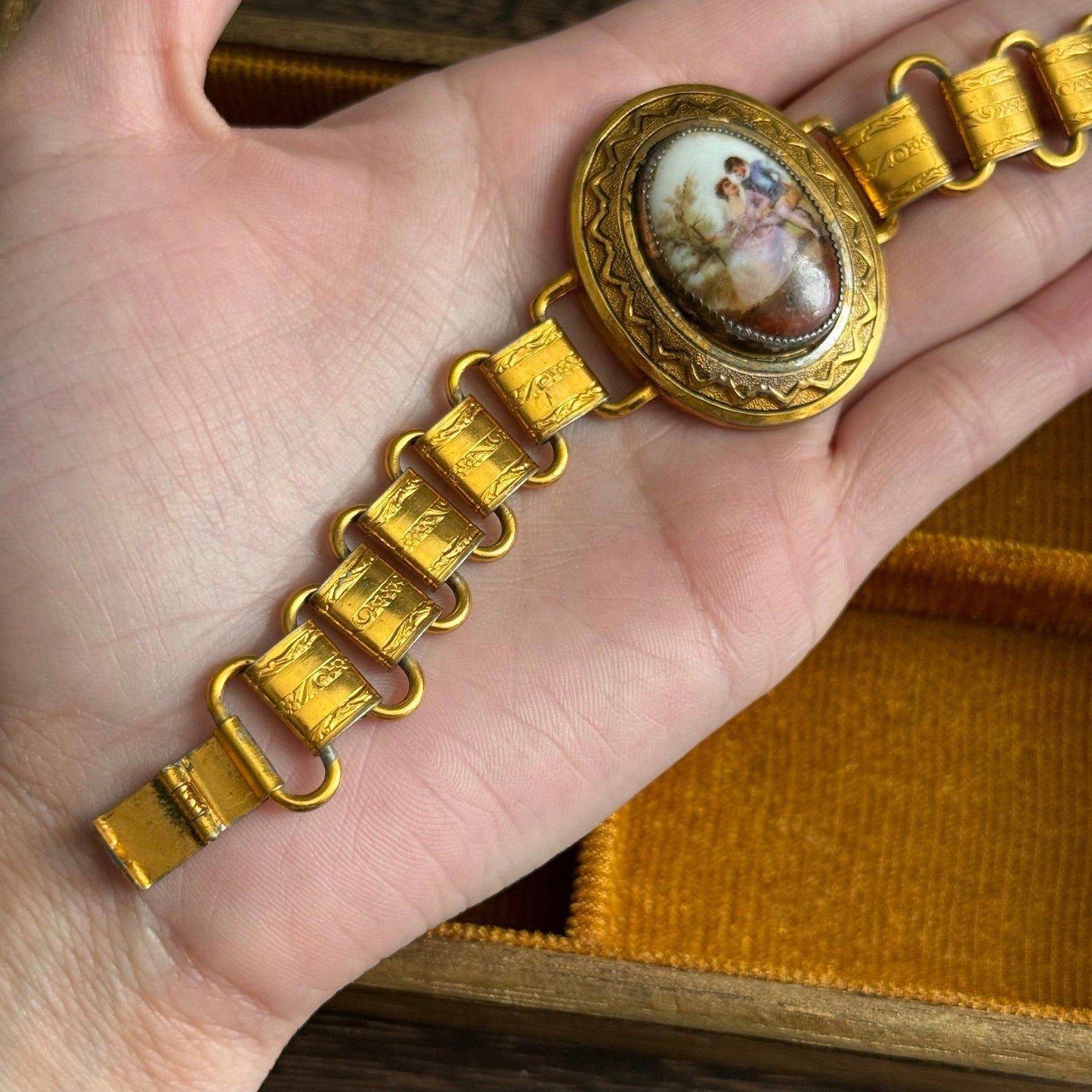 Vintage bookchain bracelet with an oval porcelain cameo in the center