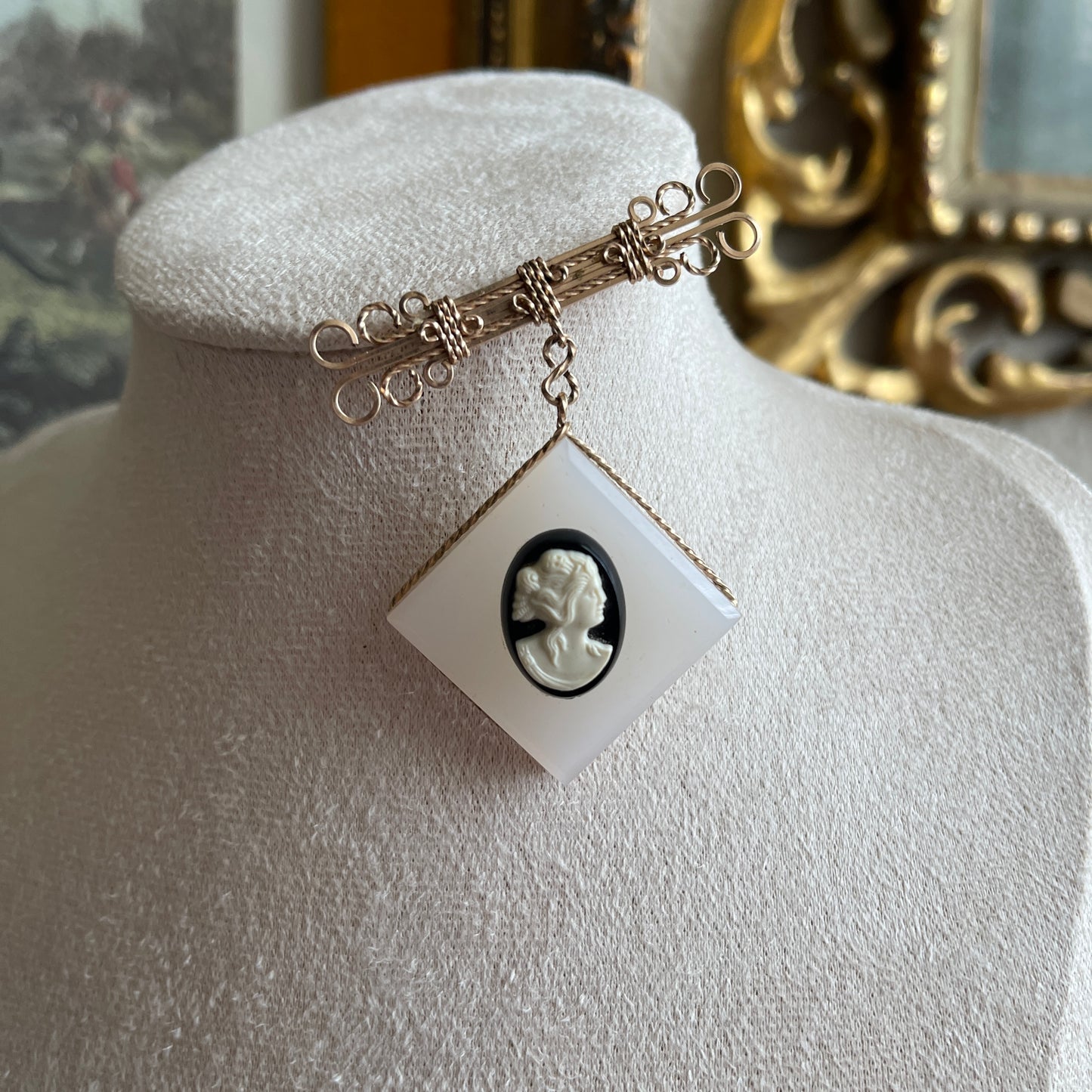 Vintage gold gilt wire dangling brooch with black and white Cameo