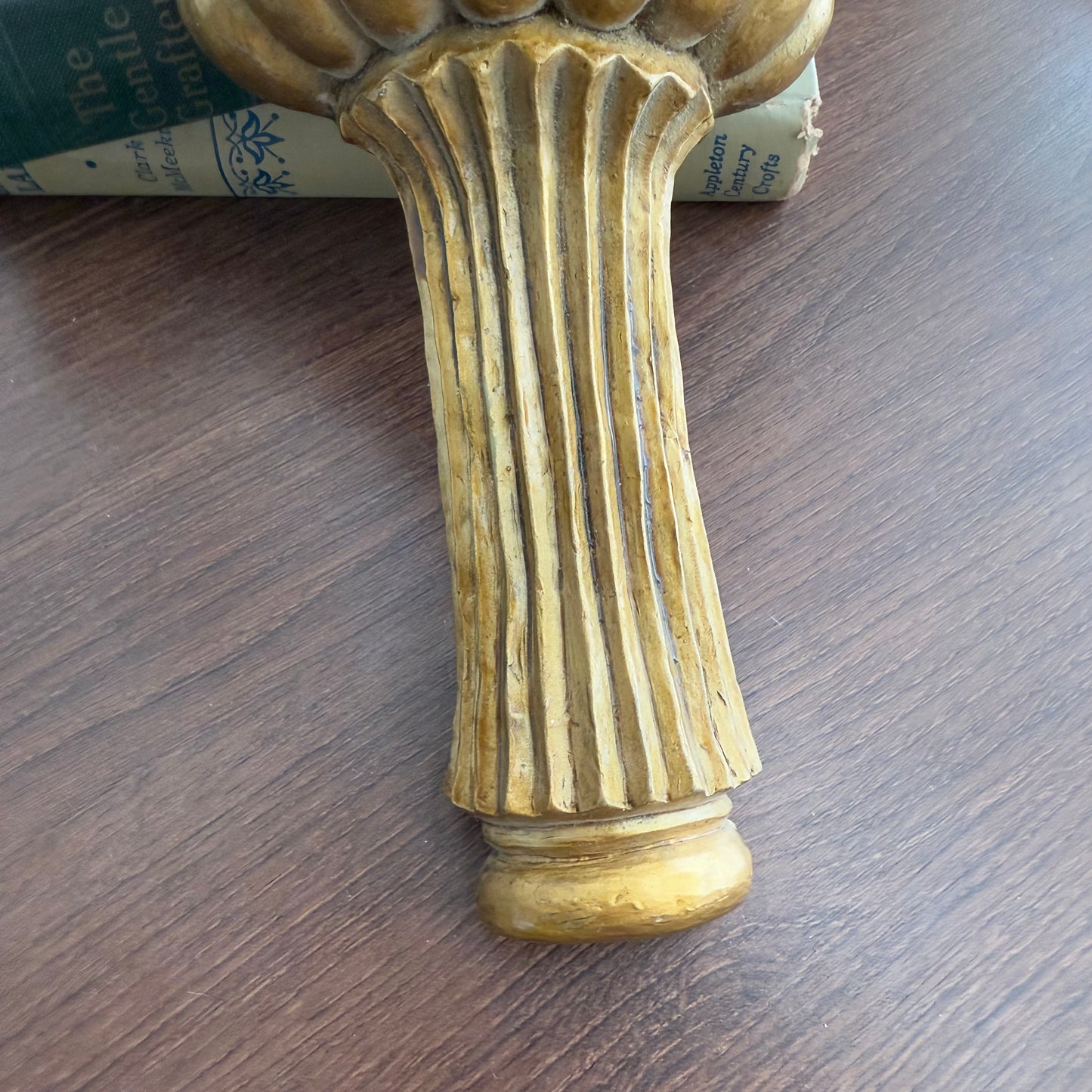 Gold tone wall shelf