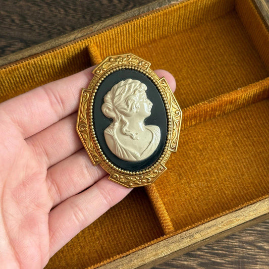 Vintage Gold tone black and white Faux Cameo brooch