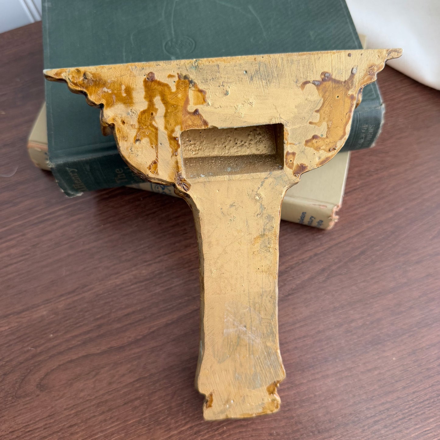 Gold tone wall shelf