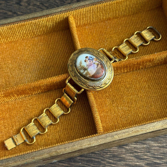 Vintage bookchain bracelet with an oval porcelain cameo in the center