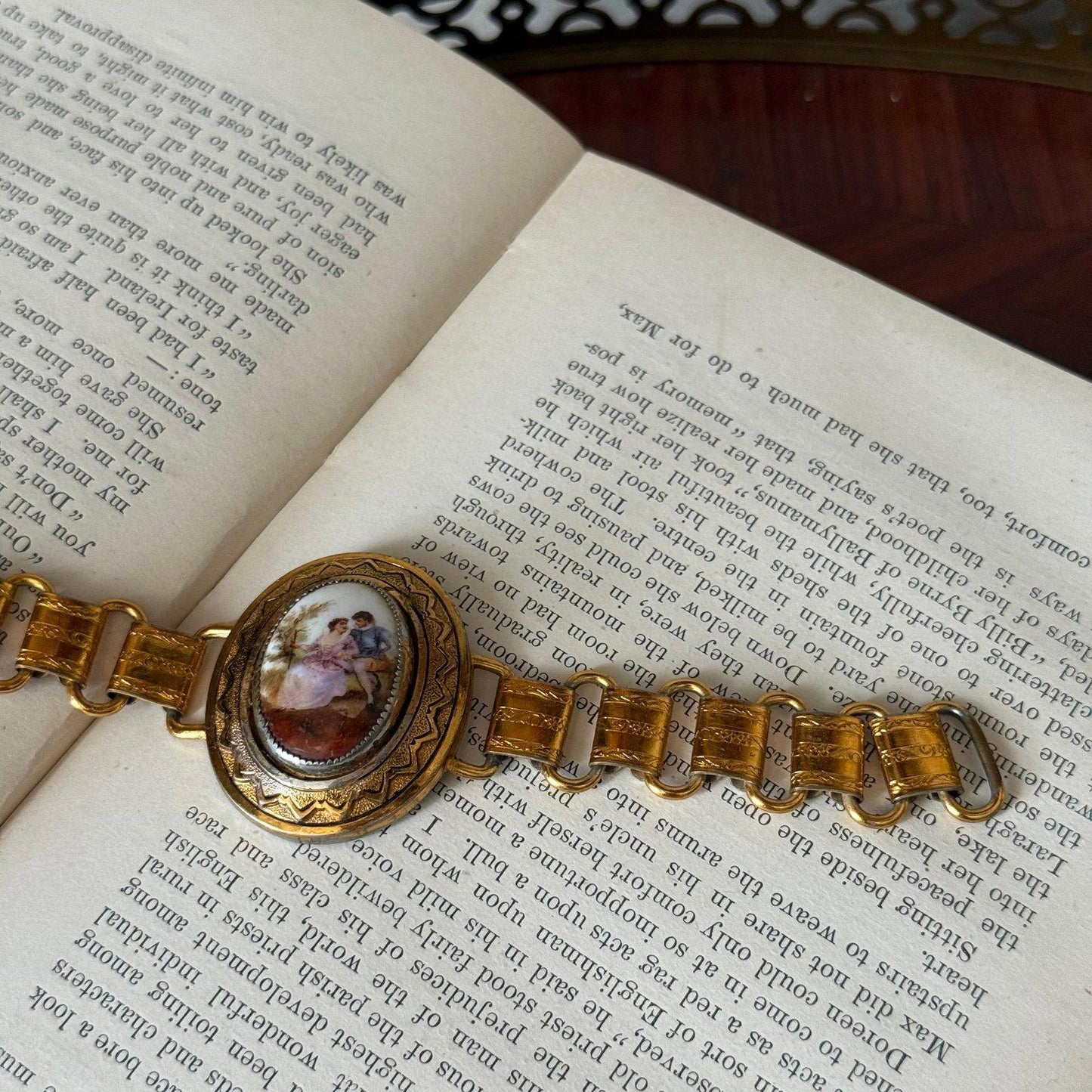Vintage bookchain bracelet with an oval porcelain cameo in the center