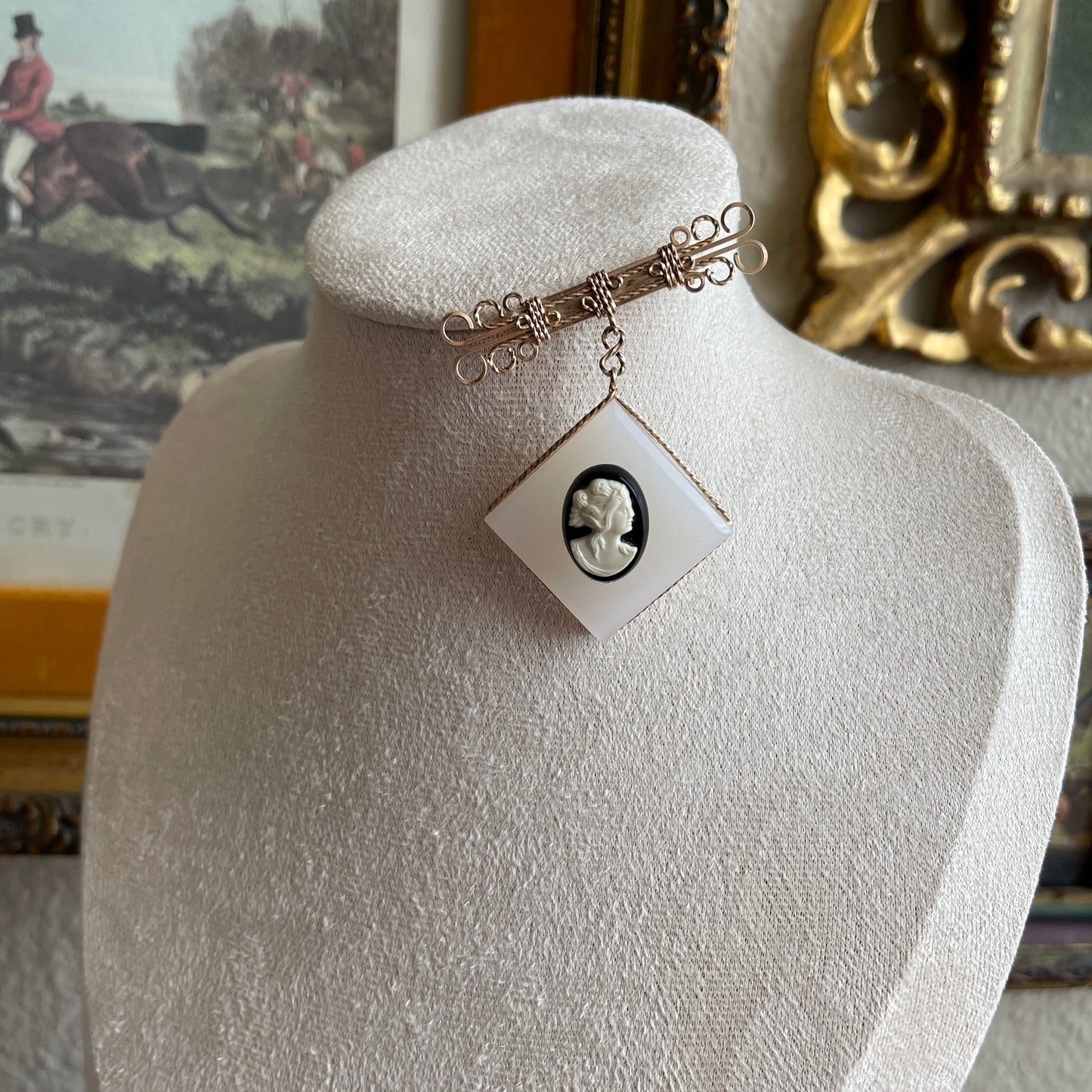 Vintage gold gilt wire dangling brooch with black and white Cameo