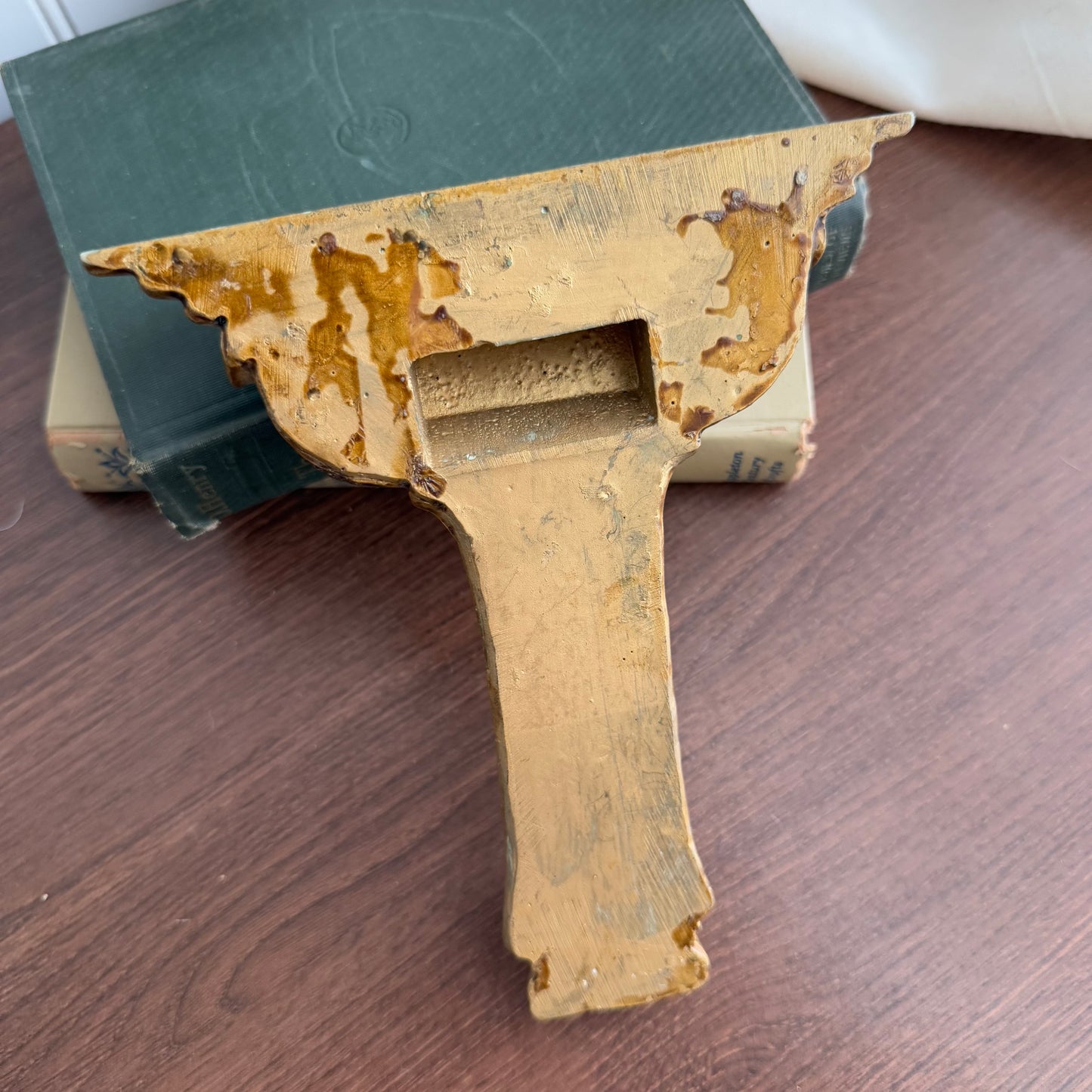 Gold tone wall shelf