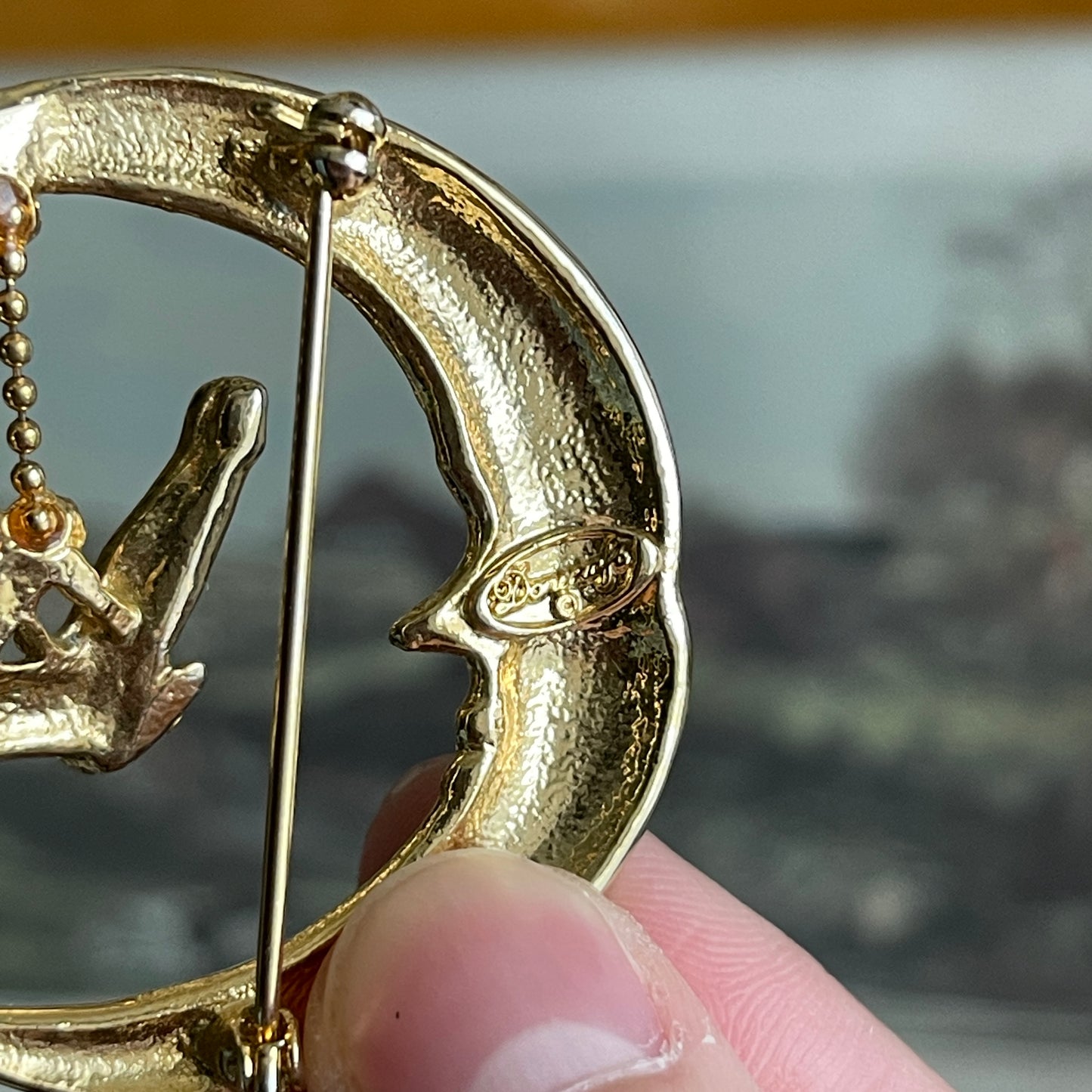 Vintage angel angel swinging from moon pin Signed Danecraft brooch