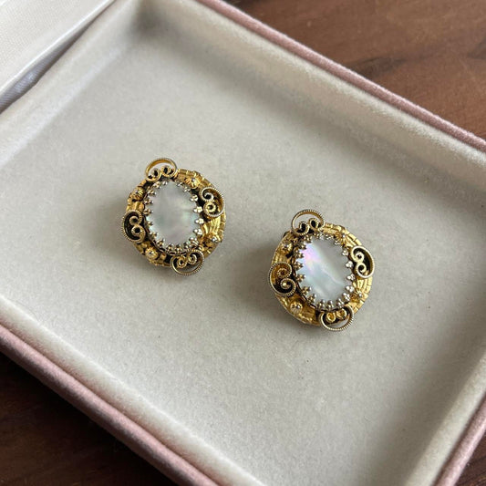 Vintage gold tone mother of pearl clip on earrings