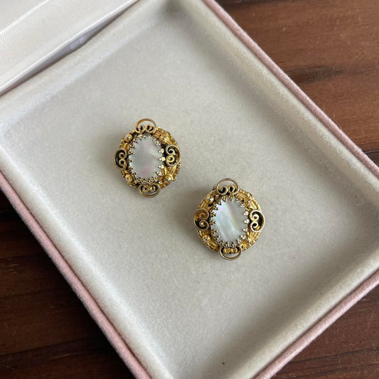 Vintage gold tone mother of pearl clip on earrings