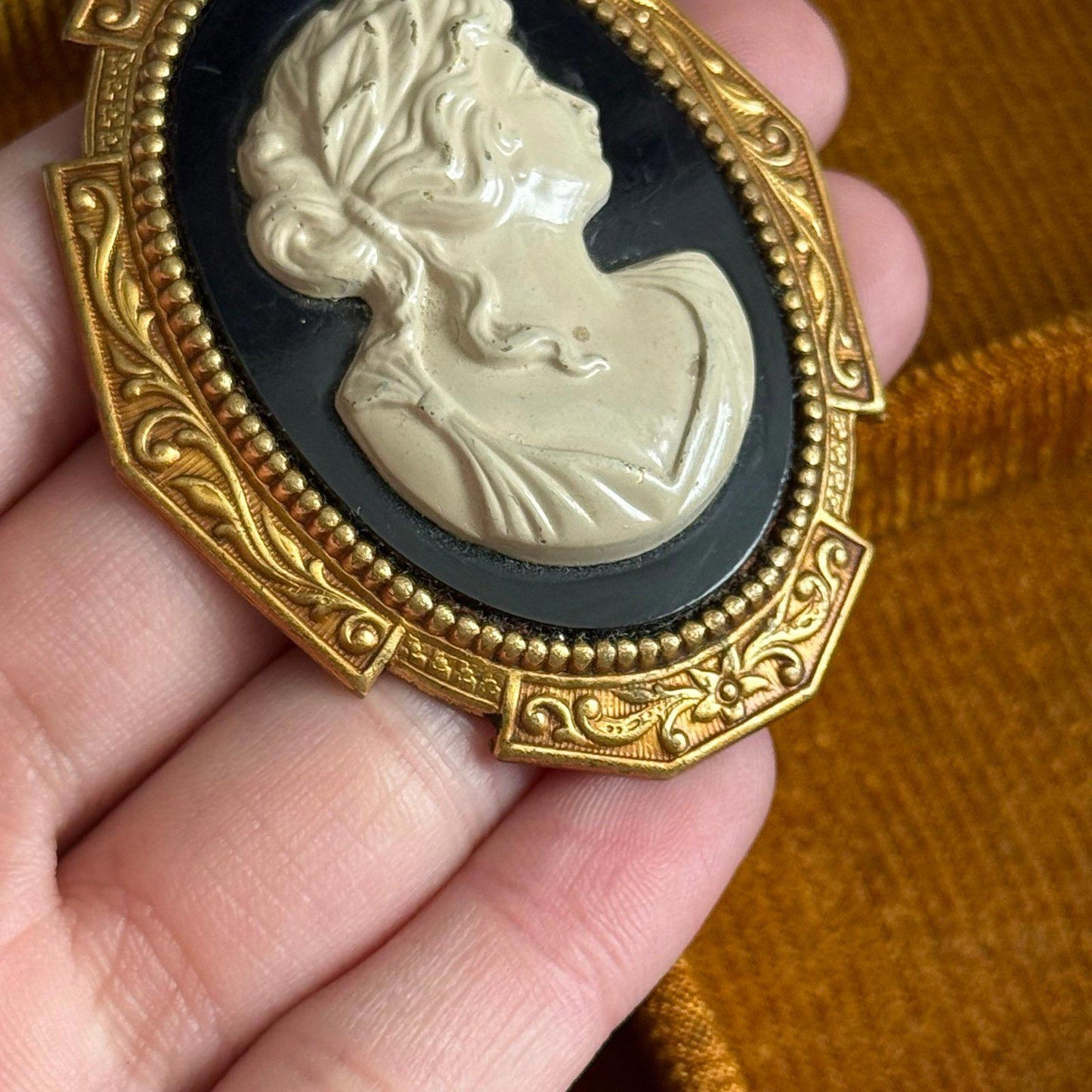 Vintage Gold tone black and white Faux Cameo brooch