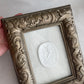 Vintage ornate plaster framed Intaglio