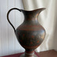 Vintage brass pitcher with etched details