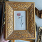 Gold Ornate leaf frame with flower print