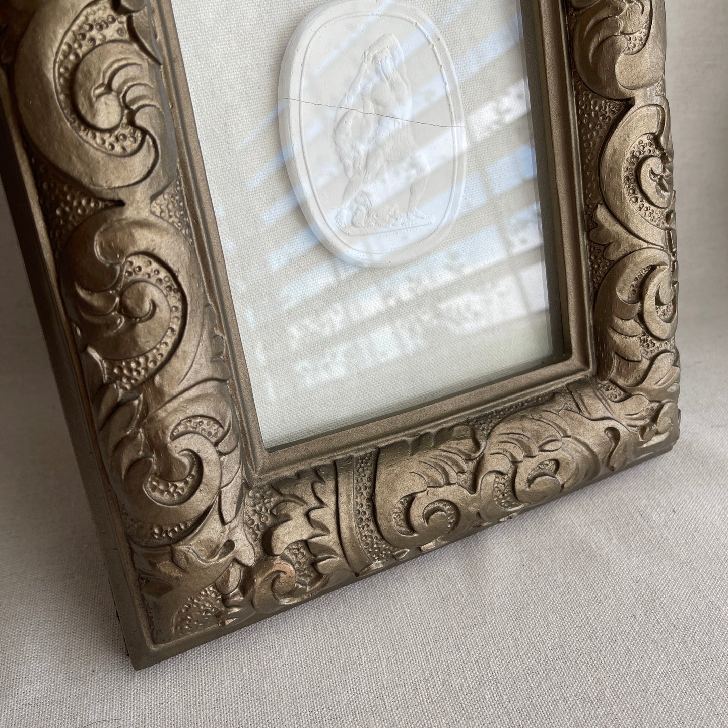 Vintage ornate plaster framed Intaglio