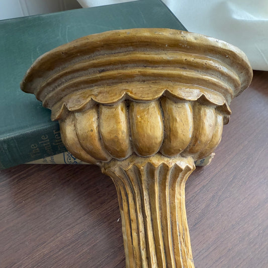 Gold tone wall shelf