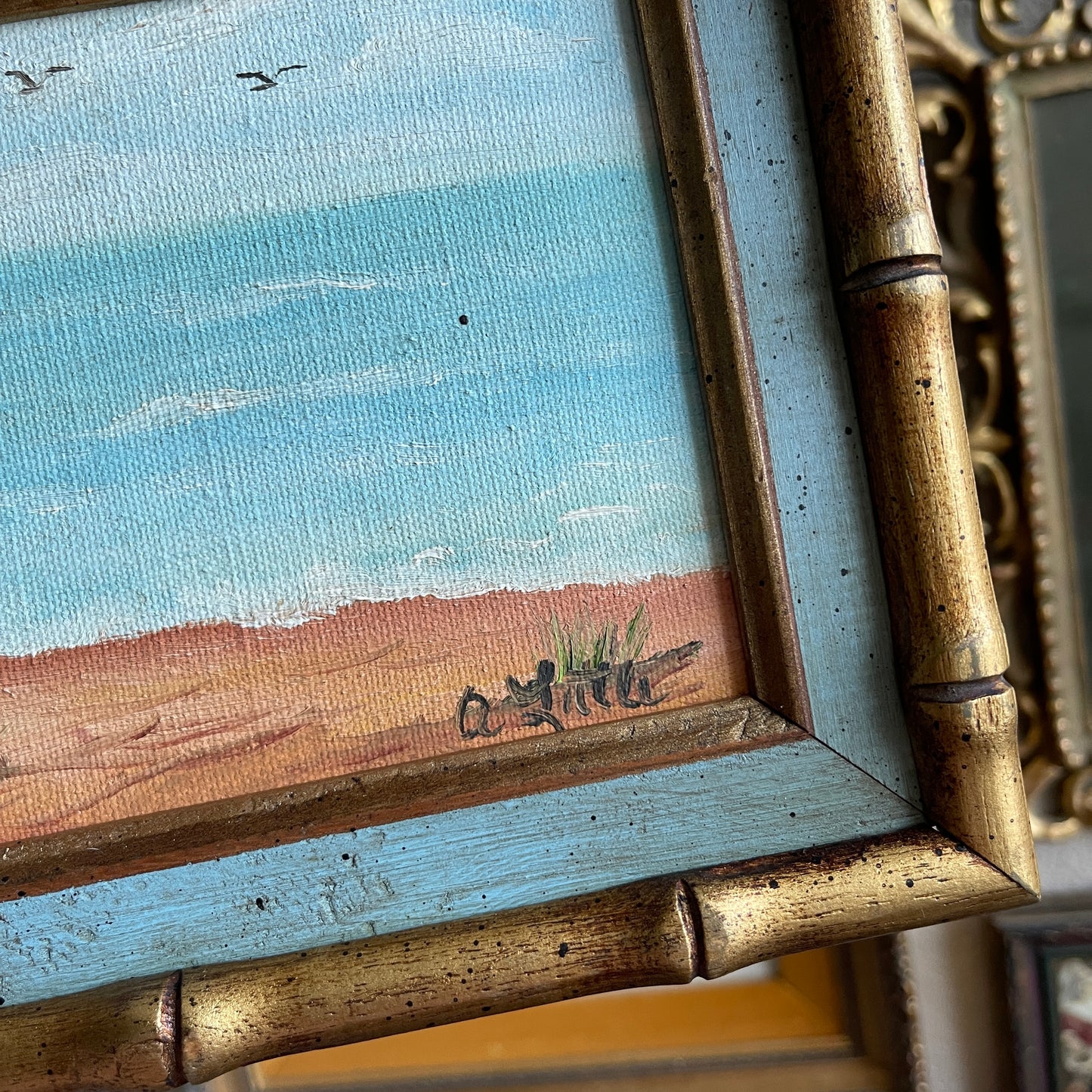 Vintage ocean painting in wooden bamboo style frame