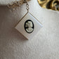 Vintage gold gilt wire dangling brooch with black and white Cameo