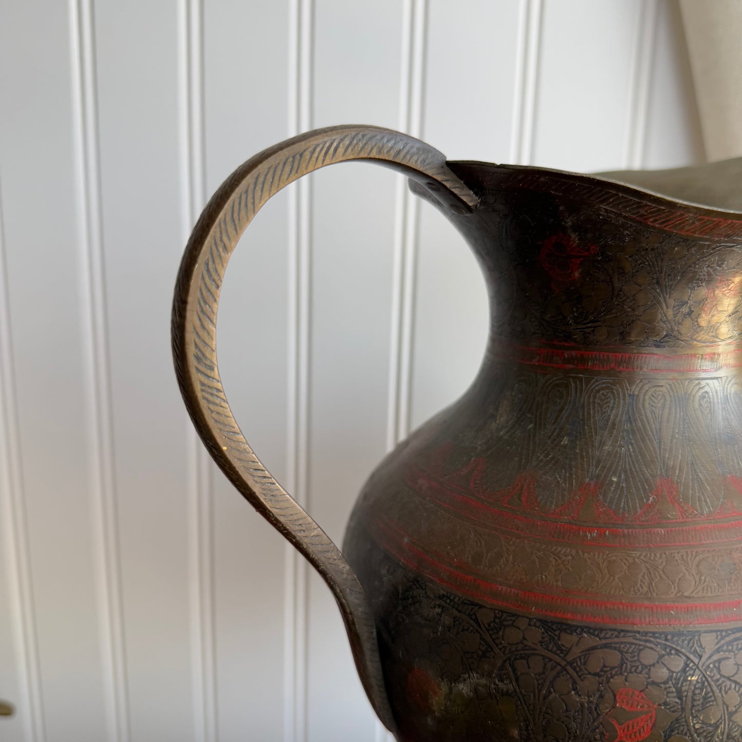 Vintage brass pitcher with etched details