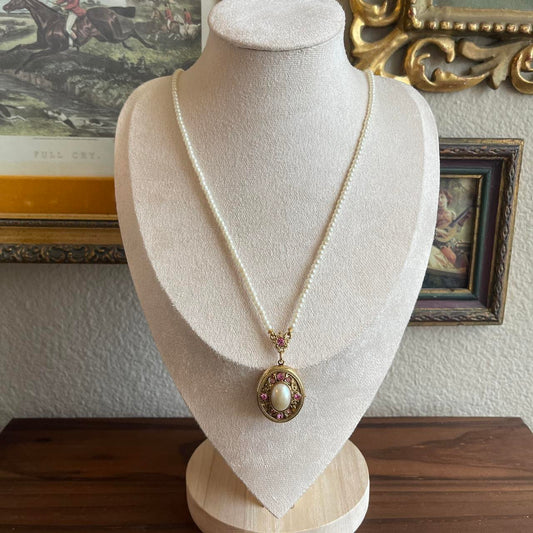 Vintage 1928 pearl necklace with locket with pink rhinestone