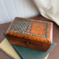 Vintage wooden box with metal inlay