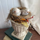 Bird nest on pedestal