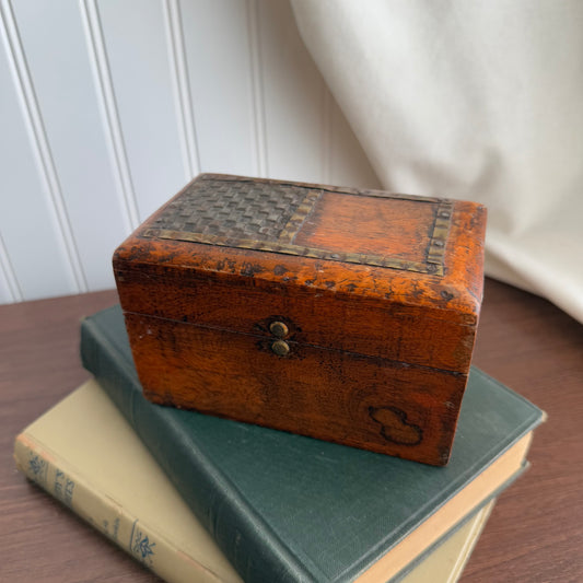 Vintage wooden box with metal inlay