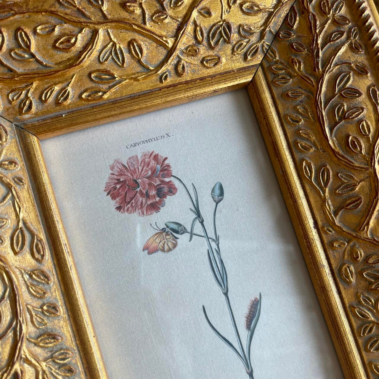 Gold Ornate leaf frame with flower print