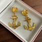 Vintage Gold anchor earrings with a rose design