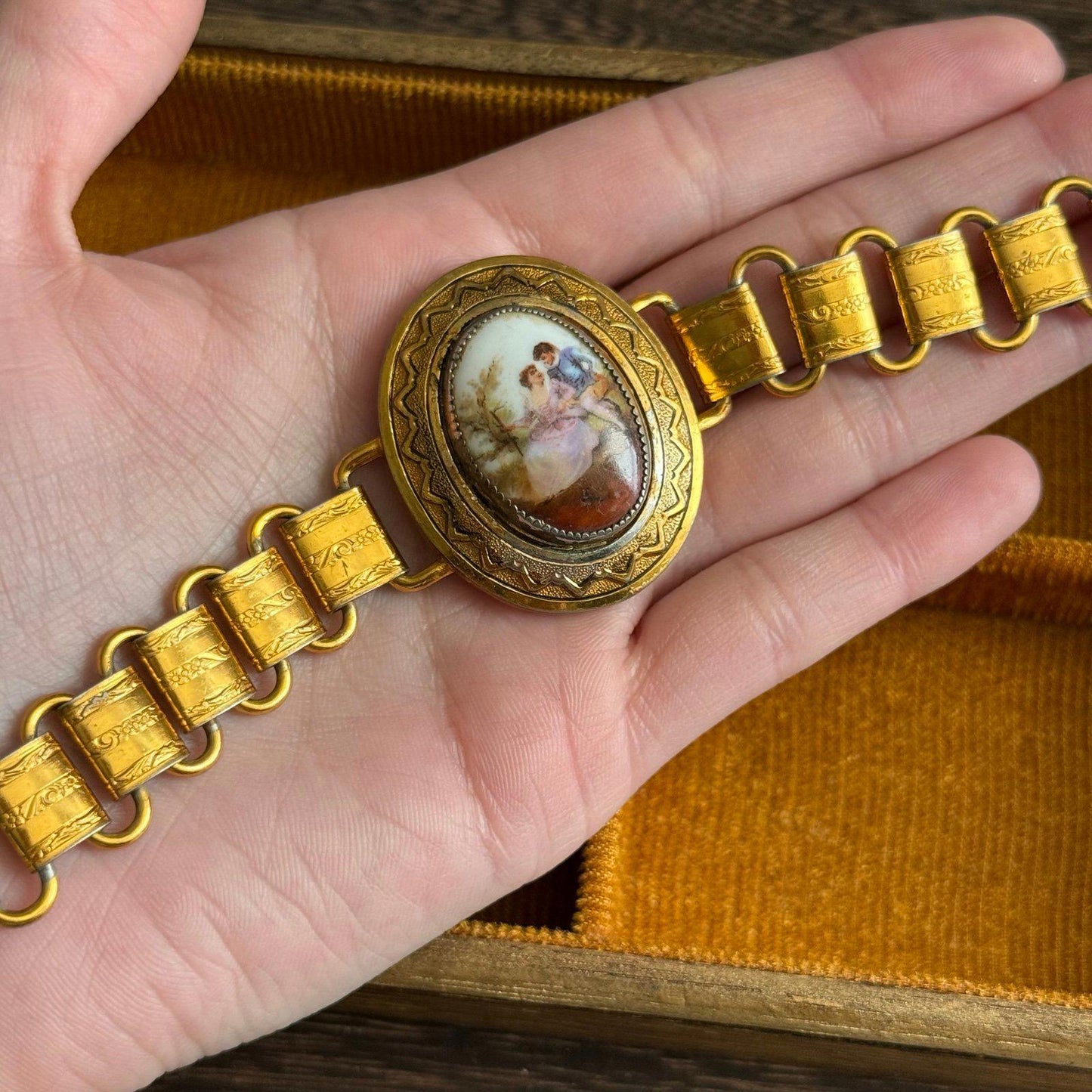 Vintage bookchain bracelet with an oval porcelain cameo in the center