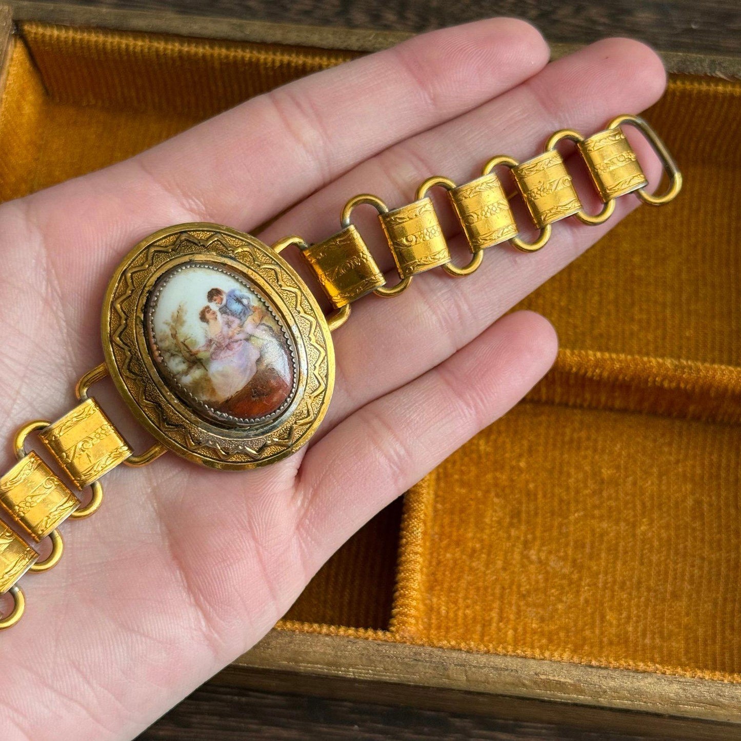 Vintage bookchain bracelet with an oval porcelain cameo in the center