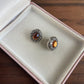 Vintage style silver tone oval orange stone earrings