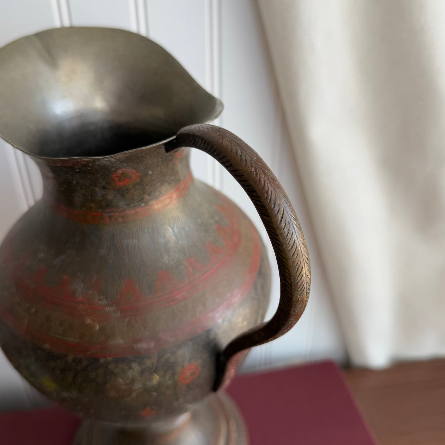 Vintage brass pitcher with etched details