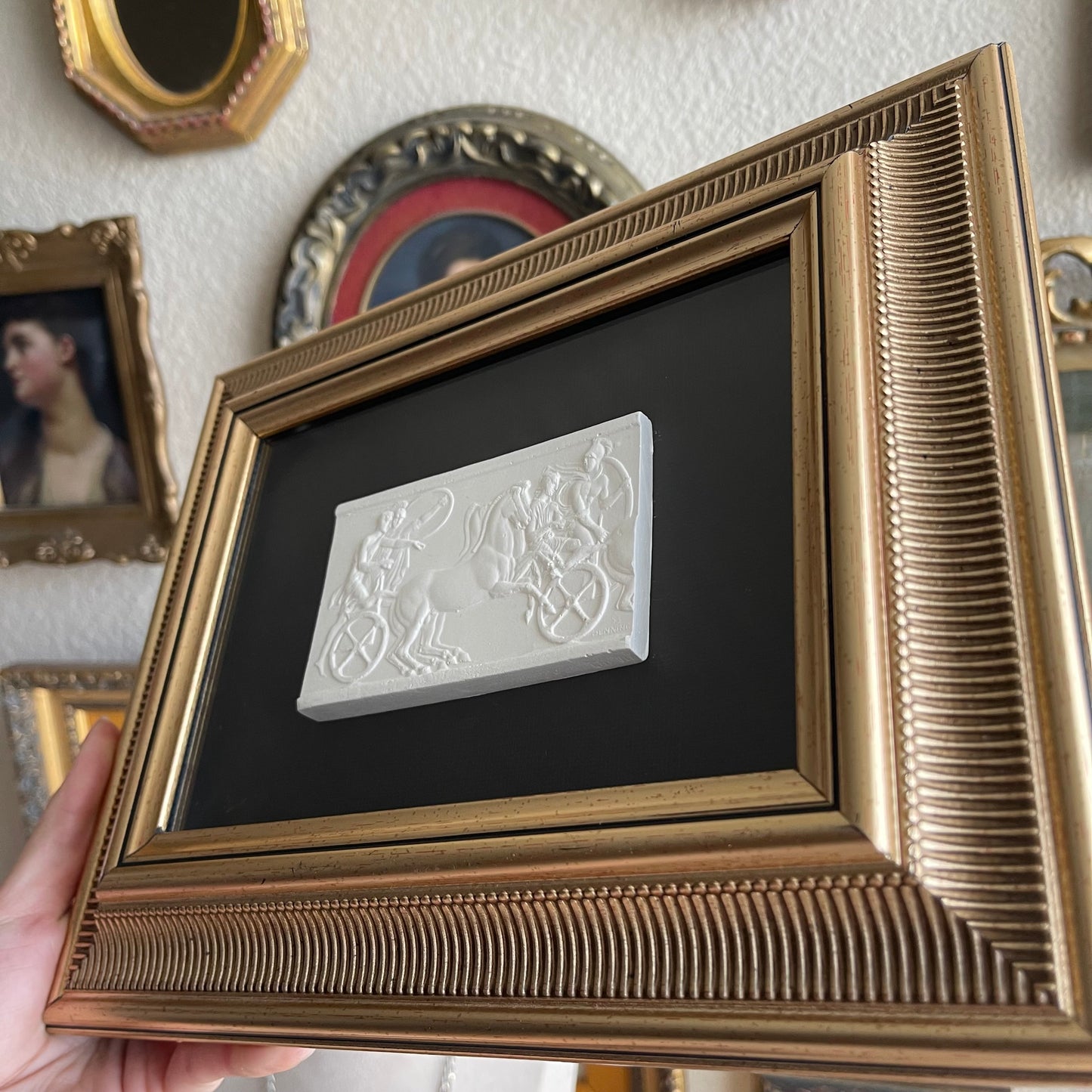 Gold Framed plaster intaglio with black textured background art work