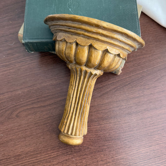 Gold tone wall shelf