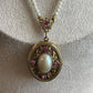 Vintage 1928 pearl necklace with locket with pink rhinestone