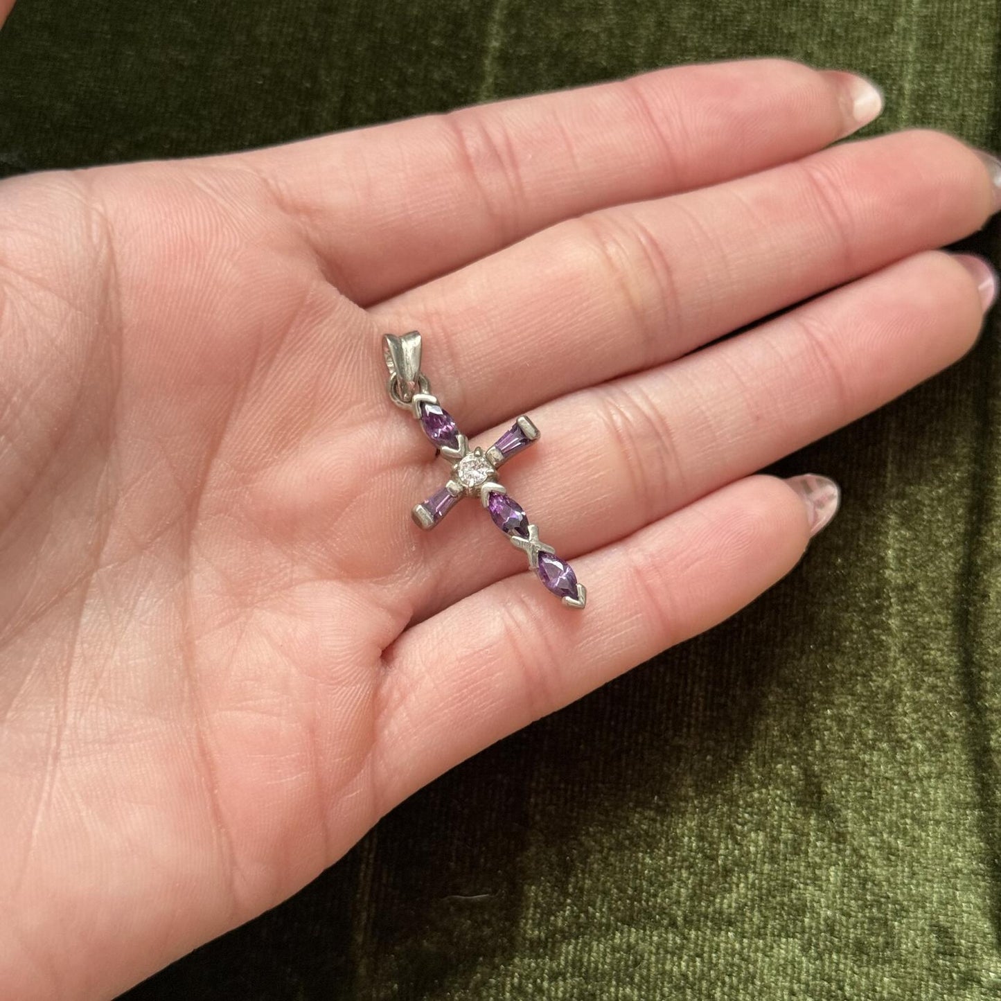 Silvertone cross pendant with purple and clear stones