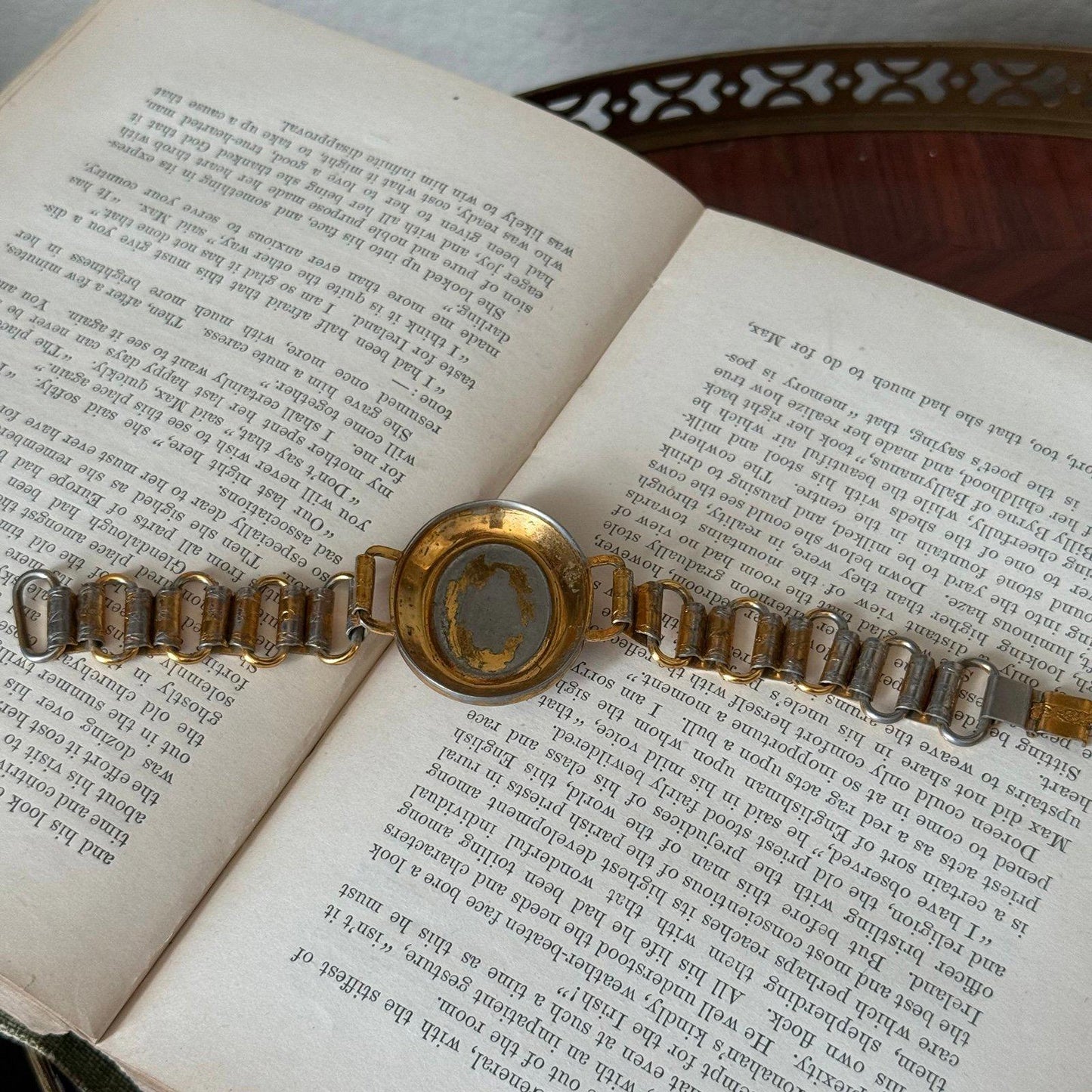 Vintage bookchain bracelet with an oval porcelain cameo in the center